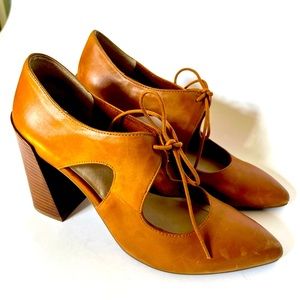 Brown leather tie up heel.